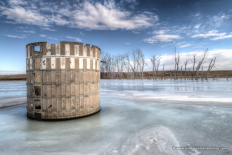 Abandoned brick silo surrounded by ice